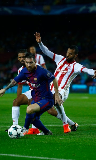 Messi nets 100th goal in Europe, Barca beats Olympiakos 3-1